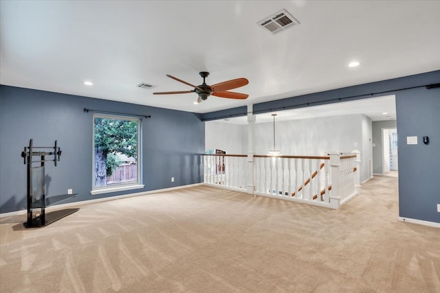 carpeted empty room with ceiling fan