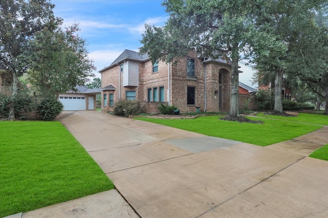 view of front of house featuring a garage and a front yard