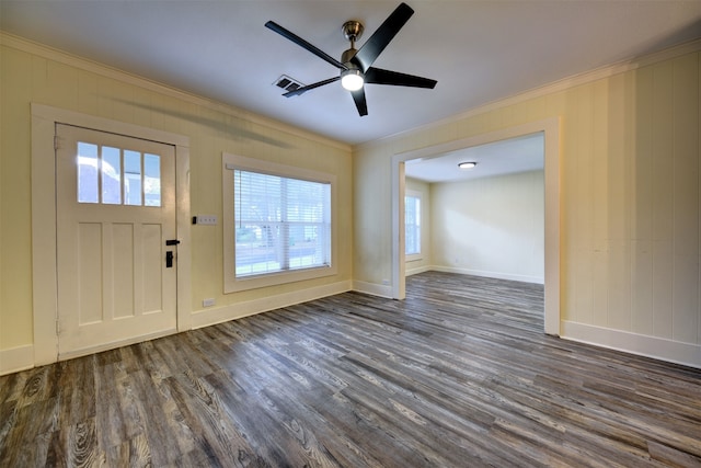 foyer entrance with dark hardwood / wood-style flooring, ceiling fan, and crown molding