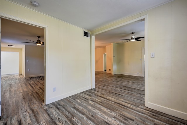 spare room featuring ceiling fan and dark hardwood / wood-style floors