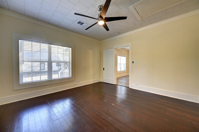 unfurnished room with dark wood-type flooring, a wealth of natural light, and crown molding