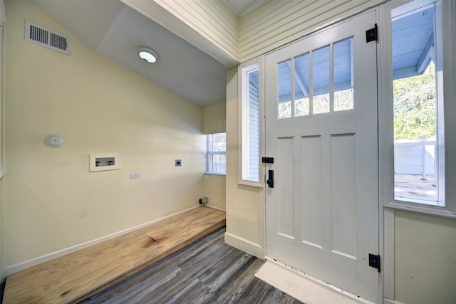 foyer entrance featuring lofted ceiling and dark hardwood / wood-style floors