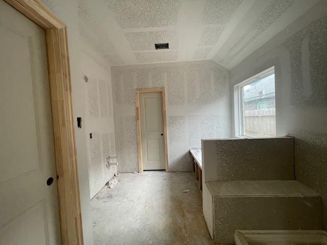 bathroom with lofted ceiling