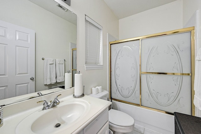 full bathroom featuring toilet, bath / shower combo with glass door, vanity, and tile patterned floors