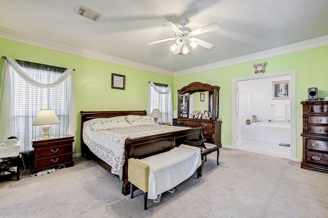 bedroom with ensuite bath, light colored carpet, ceiling fan, and crown molding