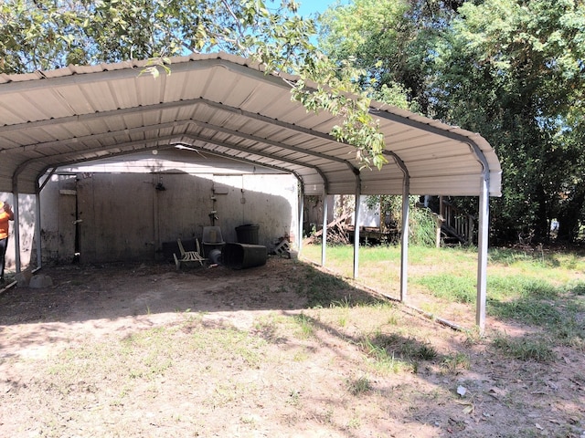 view of vehicle parking with a carport