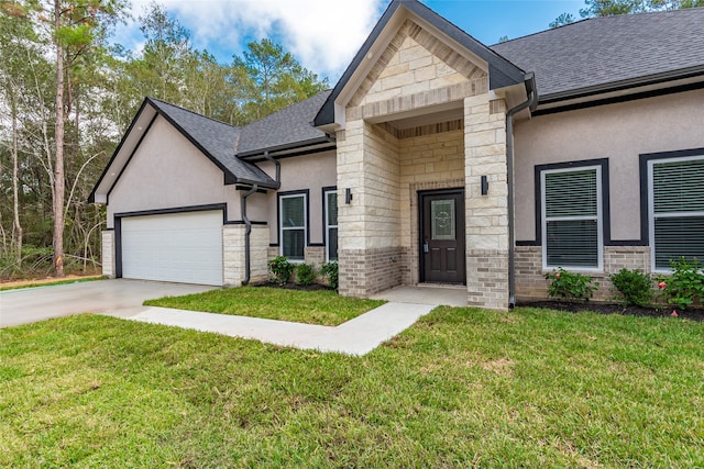 view of front of house with a garage and a front lawn