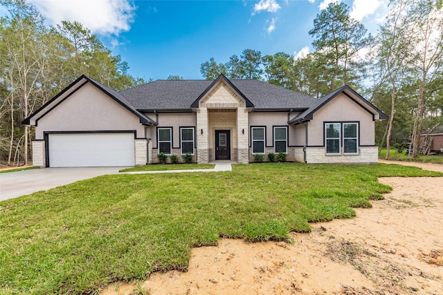 view of front of home with a garage and a front yard