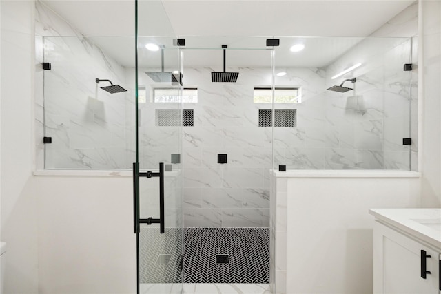 bathroom with vanity and an enclosed shower