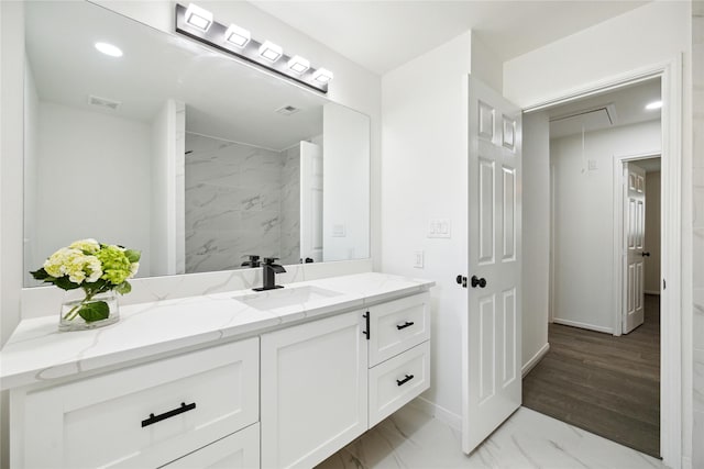 bathroom featuring hardwood / wood-style floors and vanity