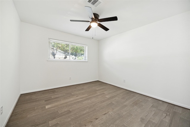 spare room featuring ceiling fan and hardwood / wood-style flooring