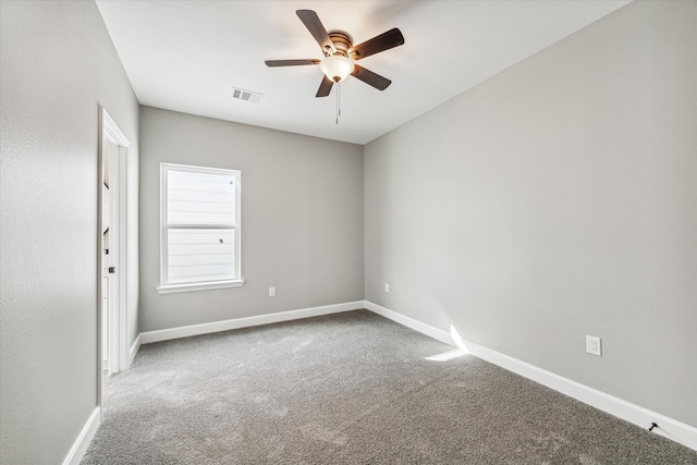 empty room with carpet floors and ceiling fan