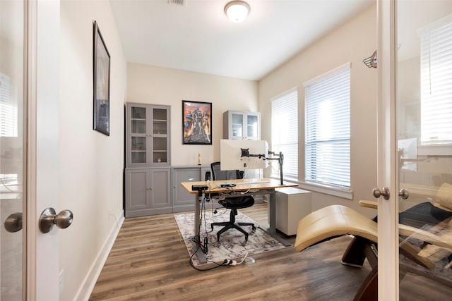 office space with hardwood / wood-style floors and french doors