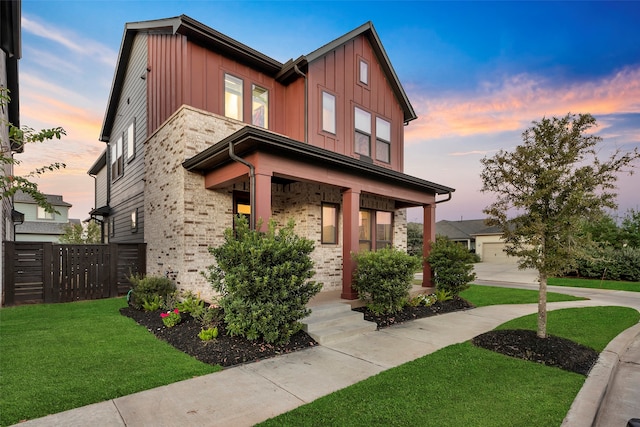 view of front facade with a lawn and a garage