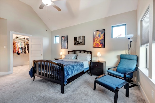 carpeted bedroom with high vaulted ceiling, a closet, a spacious closet, and ceiling fan