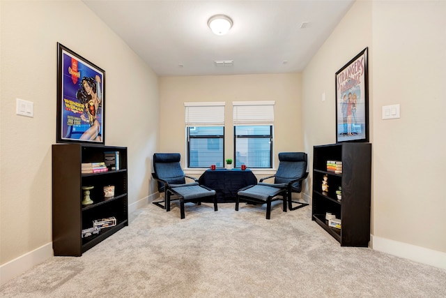 sitting room with light carpet