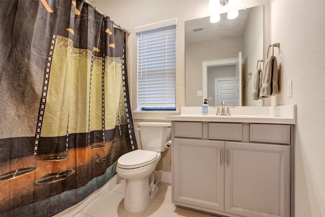 bathroom with tile patterned floors, vanity, and toilet