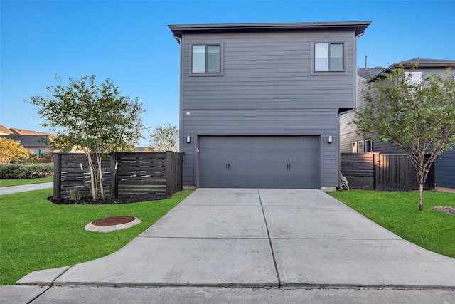 view of front facade featuring a garage and a front yard