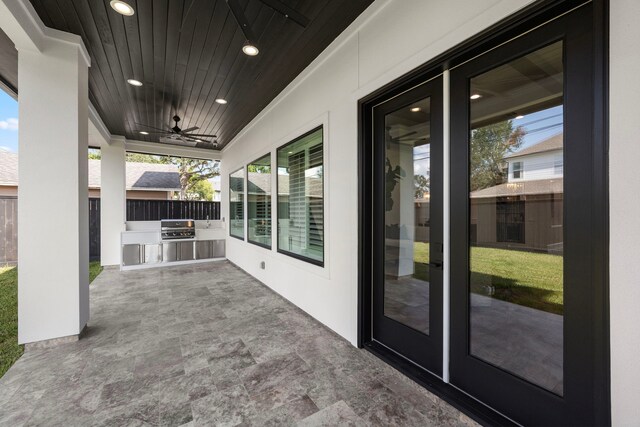 view of patio / terrace featuring area for grilling and ceiling fan