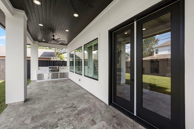 view of patio / terrace featuring fence, a ceiling fan, and area for grilling