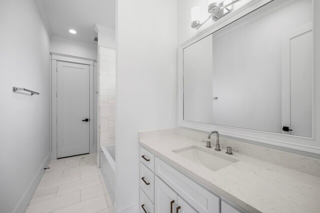 bathroom featuring vanity, tile patterned floors, and crown molding