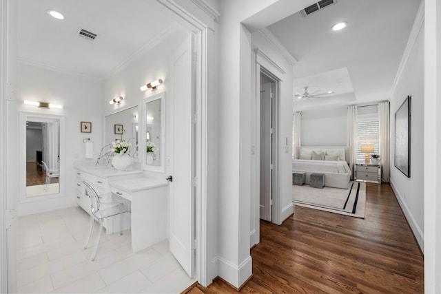 bathroom with hardwood / wood-style flooring, ceiling fan, vanity, and crown molding