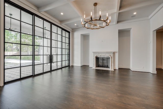 unfurnished living room with beam ceiling, a premium fireplace, and dark wood-type flooring