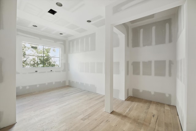 empty room with light hardwood / wood-style flooring