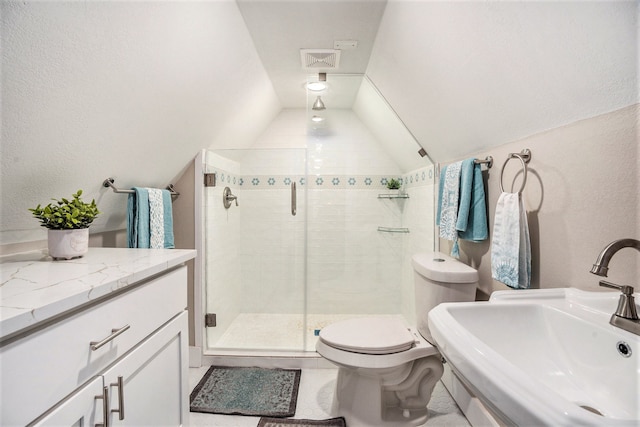 bathroom with tile patterned floors, walk in shower, vaulted ceiling, sink, and toilet