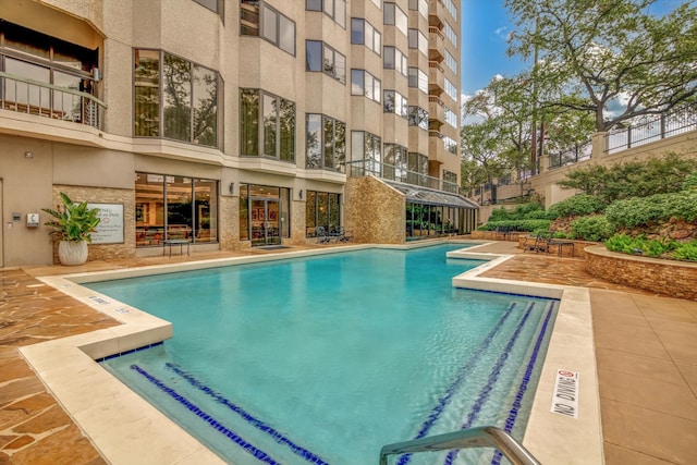 view of swimming pool with a patio