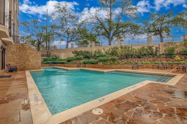 view of pool featuring a patio