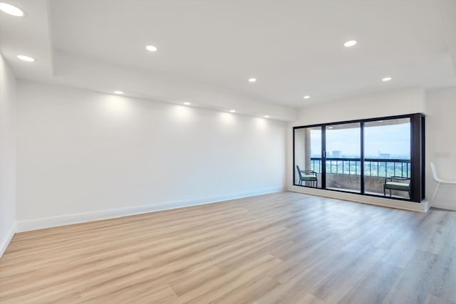 unfurnished room featuring light hardwood / wood-style floors