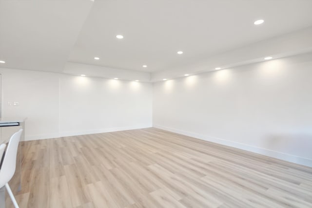 spare room with light wood-type flooring