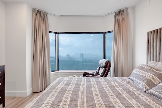 bedroom with light hardwood / wood-style floors