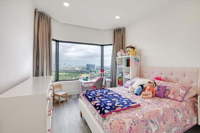 bedroom with wood-type flooring