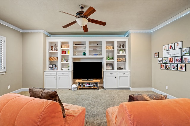 living room with crown molding, carpet floors, and ceiling fan