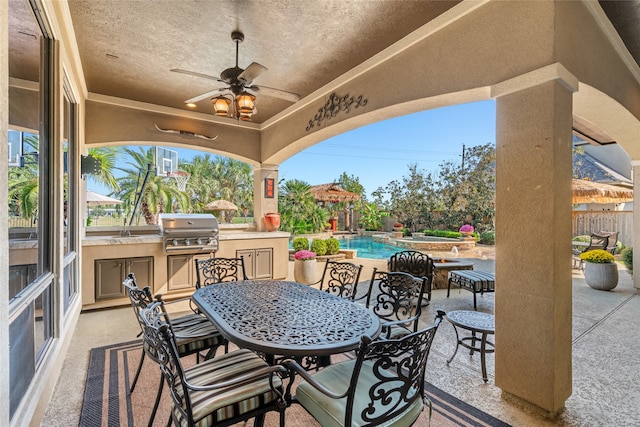 view of patio featuring sink, an outdoor kitchen, grilling area, and ceiling fan