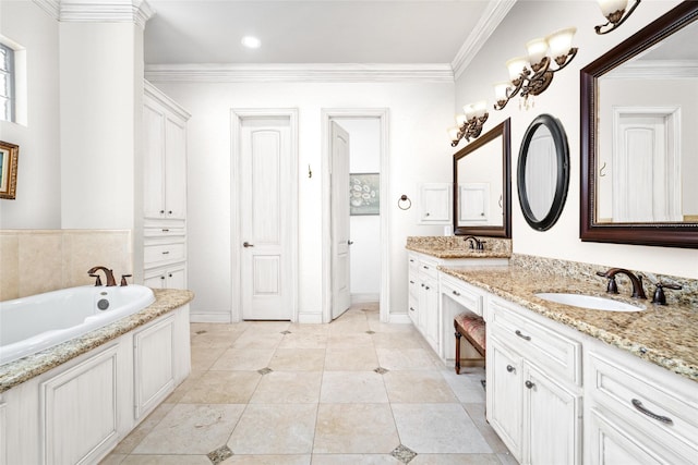 bathroom featuring vanity, tile patterned floors, crown molding, and a tub