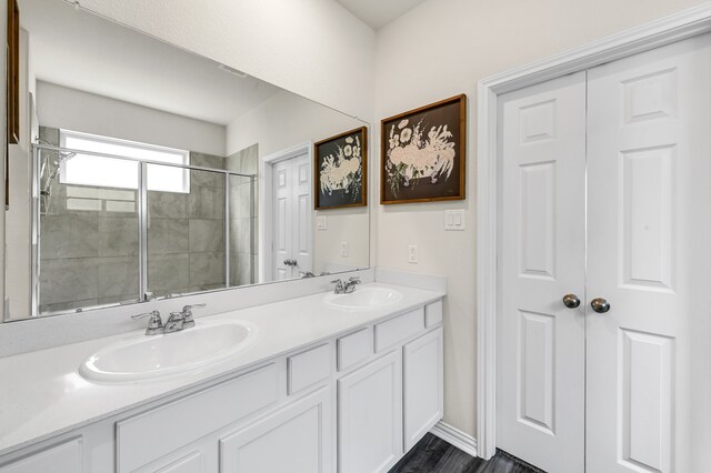 bathroom with vanity and an enclosed shower