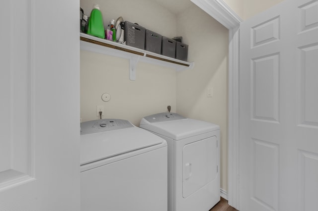 washroom with independent washer and dryer