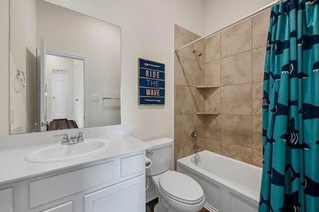 full bathroom with shower / bathtub combination with curtain, vanity, and toilet