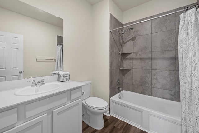 full bathroom with wood-type flooring, toilet, vanity, and shower / bath combo with shower curtain