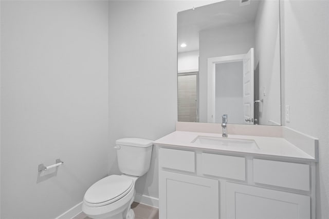 373 Spruce Oak Ln, Waller, TX 77484 - bathroom featuring toilet, baseboards, and vanity
