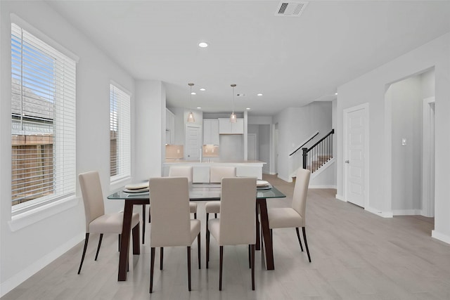 373 Spruce Oak Ln, Waller, TX 77484 - dining space featuring stairs, baseboards, light wood-type flooring, and recessed lighting