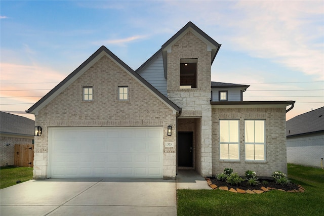 373 Spruce Oak Ln, Waller, TX 77484 - view of front facade with driveway, a garage, and stone siding