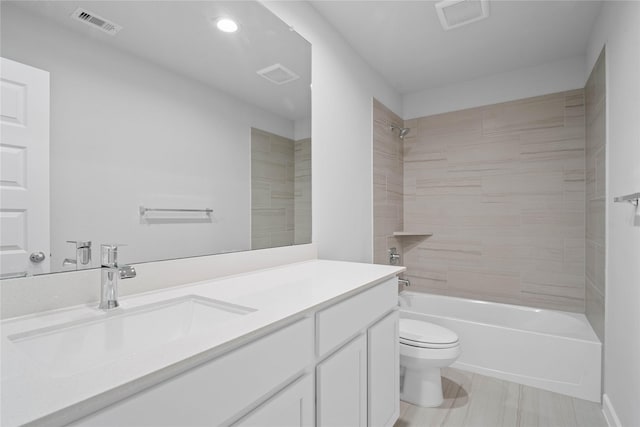 373 Spruce Oak Ln, Waller, TX 77484 - full bathroom with toilet, vanity, shower / washtub combination, and recessed lighting