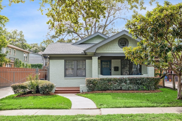 bungalow featuring a front yard