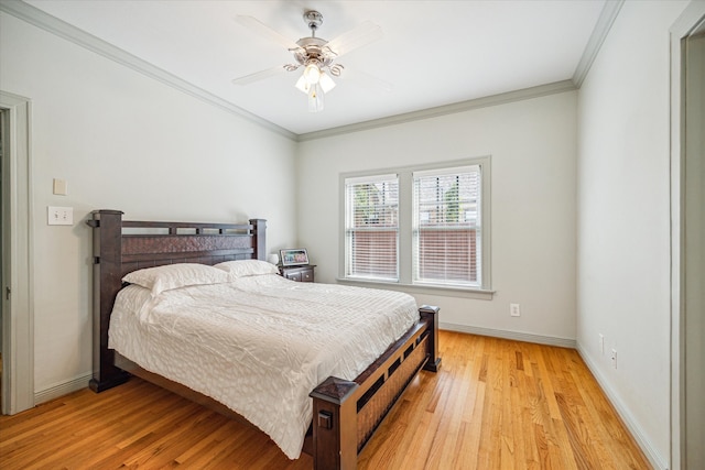 bedroom with ornamental molding, ceiling fan, and light hardwood / wood-style flooring