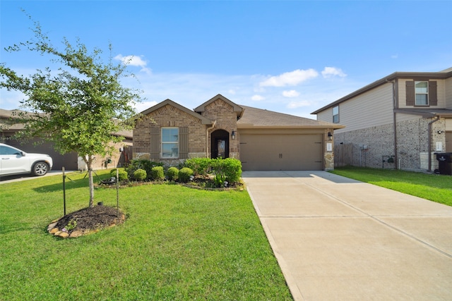 view of front of house featuring a garage and a front yard