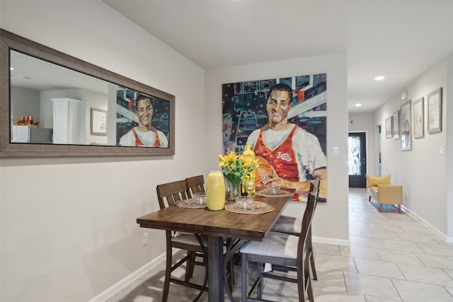 dining area featuring light tile patterned floors